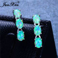 JUNXIN Luxury Oval Stone Blue White Fire Opal Earrings For Women Silver Color Green Purple Bar Stud Earrings Wedding Jewelry.