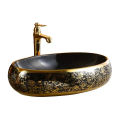 High Quality Luxury Modern Oval Art Basin Ceramic Gold Black Bathroom Sink Counter Top Hand Wash Basin. 