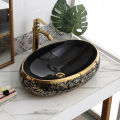 High Quality Luxury Modern Oval Art Basin Ceramic Gold Black Bathroom Sink Counter Top Hand Wash Basin. 