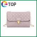 Ladies embossed one-shoulder chain small square bag Korean version of autumn and winter bag lid lock small bag. 