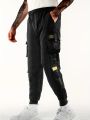 Workwear pants for men's spring and autumn styles with multiple pockets and ankle straps, casual and versatile cropped pants. 