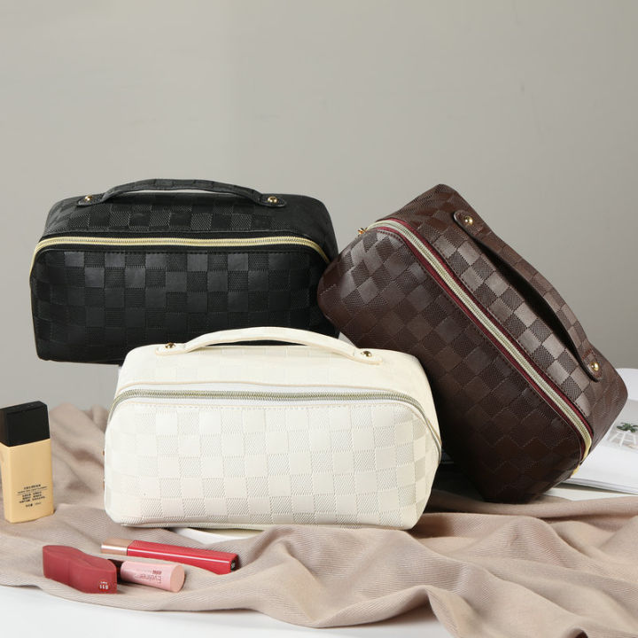 Simple checkered net red pillow makeup bag, high value, portable, waterproof, multi-functional washing and storage bag cross