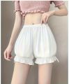 Women’s Silk Puffy Style Shorts with Ruffle Trim.
