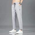 New Men'S Korean Fashion Casual Summer Thin Quick Drying Ice Silk Straight Pants Loose Sports 9-Point Trousers Boy. 
