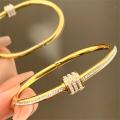 New gold titanium steel bracelet for women, high-end zircon couple bracelet, light luxury plain ring bracelet, hand jewelry. 