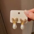 Korean version of fashion hot selling earrings simple temperament crystal butterfly pearl ear nail Earrings women. 