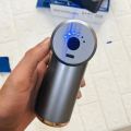 Powerful Handheld Massage Gun for Deep Tissue Relief - Compact & Elegant Design.