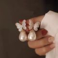 Korean version of fashion hot selling earrings simple temperament crystal butterfly pearl ear nail Earrings women. 