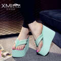High heeled slippers for women in summer, thick soled herringbone beach shoes, sloping heels, clip on sandals, and sponge shoes. 