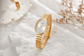 Women Quartz Watch Oval Shaped Fashion Mini Case Small Roman Numeral Dial Female Full Metal Band Watches Niche Wristwatch. 