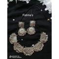 Women fashionable antique silver necklace set with earrings. 
