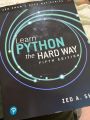 Learn Python the Hard Way (Zed Shaw's Hard Way Series) by Zed Shaw. 
