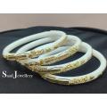 White Shakha Pola Bangles for Women 4 Pcs Plastic. Party , Wedding , Anniversary , Druga Puja & All Time Use Sakha Bangles. Model:CD160.. 
