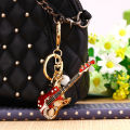rhinestone small guitar car keychain female Korean version creative bag pendant metal key chain ring foreign trade gifts wholesale.