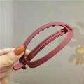 Korean version oval large straight buckle with a headband at back of the head pure color simple twist hair clip. 