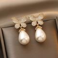 Korean version of fashion hot selling earrings simple temperament crystal butterfly pearl ear nail Earrings women. 