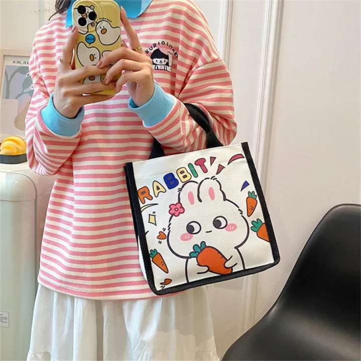 Lightweight%20Bunny%20Canvas%20Bag%20Eco-friendly%20Durable%20handles%20Canvas%20Cartoon%20Tote%20Bag%20Printed%20Design%20Cute%20Lunch%20Bag%20for%20Casual%20Outings%20School%20Accessory%20Female%20Students%20Lunch%20Storage%20Gift%20option%20-%20Image%204
