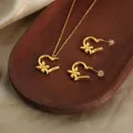 Cross border lines love butterfly flower design pendant necklace titanium steel gold plated earrings jewelry set wholesale. 