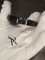 Elegant Stainless Steel Bracelet for Men - Fashionable High-Quality Metal Bracelet with Brand Logo.