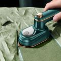 MINI ELECTRIC HANDHELD STEAMER IRON.