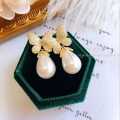 Korean version of fashion hot selling earrings simple temperament crystal butterfly pearl ear nail Earrings women. 