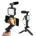 Exclusive AY-49 Phone Vlog Tripod Kit with Remote Control, Microphone, and LED Light. 