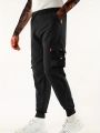 Workwear pants for men's spring and autumn styles with multiple pockets and ankle straps, casual and versatile cropped pants. 