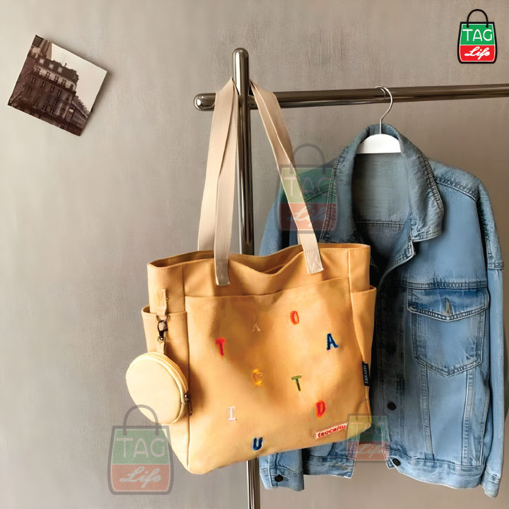 TAG%20Lifestyle%20Exclusive%20Alphabet%20Embroidery%20Design%20Canvas%20Tote%20Bag%20Sand%20Brown%20Color%20Fashionable%20Top%20Handle%20With%204%20Outside%20Pockets%20Trendy%20Fashionable%20Tote%20Bag%20for%20University,%20College%20Students%20Girls%20And%20Women%20With%20Free%20Pouch,%20Pencil%20Bag%20-%20Image%205