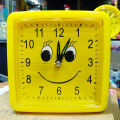 Yellow Table Alarm Clock with Clear Sound Durable Plastic Battery Operated Modern Design. 