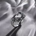 Vintage Punk Skull Hand with Heart-Shaped Ring for Men Women Hip Hop Gothic Skeleton Hand Ring Accessories Jewelry Gifts.