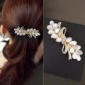 Nieuwe Koreaanse Oog Witte Kat Zirkoon Lente Haar Clip Parel Strik Boutique Legering Top Clip Elegante Vrouwen Mode haar Sieraden. 