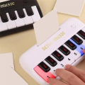Mini Pocket Piano 15 Keys Simulation Electronic Piano Toy Teaching Musical Instrument White. 