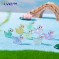 Mini Duck Statue Sparkling Duck Ornament Cute Resin Craft for Desktop Garden Dollhouse Decoration Glitter Duck Ornament.