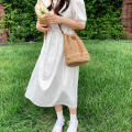 Eco-Friendly Bamboo Handle Straw Bag Chic Natural Lightweight Handmade Bamboo Woven Handbag Sustainable Handcrafted Handmade Straw Woven Beach Bag for Beach Vacations Summer Outings Casual Gatherings. 