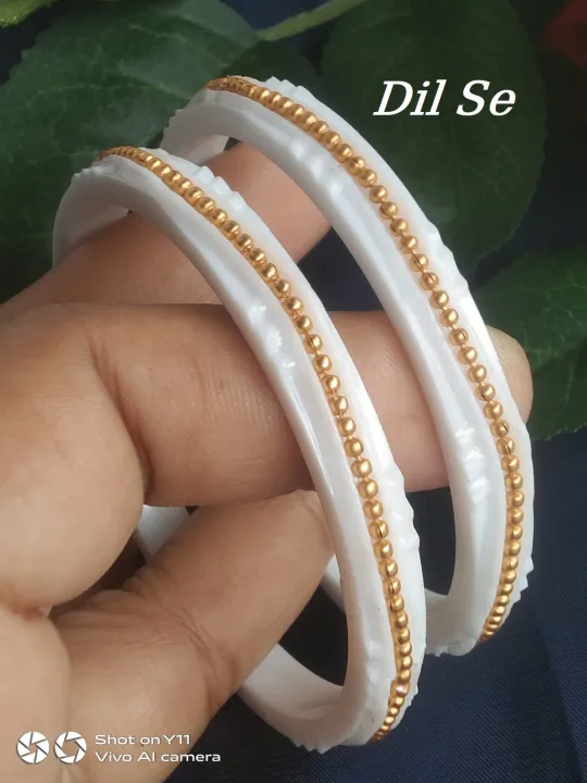 White%20Plastic%20bangles%20with%20golden%20metal%20works%20-%202pcs,%20Shankha%20design%20bangles%20-%20Image%202