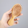MIni Anti-Static Wood Hair Brush with Extendable Comb Design for Healthy Scalp Care.