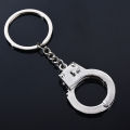 Manufacturers wholesale creative handcuff shape keychain metal small toy mini pendant car key ring gifts. 
