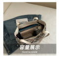 Large capacity one-shoulder handbag  new niche ins canvas bag lazy style tote class commuter bag. 