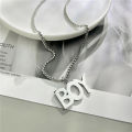 Cross-border European and American hip-hop titanium steel necklace men's tide versatile pendant retro personality accessories women's long sweater chain pendant.
