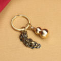 Brass hollow gourd keychain, cinnabar bottle on the lid copper gourd five emperor money key pendant factory direct supply.