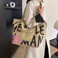 Simple Versatile Canvas Handbag Personalized Letter Printed Shoulder Bag Fashionable Large Capacity Commuter Tote Bag. 