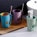 Double-layer mouthwash cup plastic simple with handle small fish wash cup household bathroom toothbrush cup. 