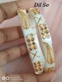 Uniqe and Gorgious Golden Metal Leaf designed Works Plastic Shakha Pola Bangles. It's for Women White , Party , Wedding , Anniversary , Durga Puja & All Time Use.. 