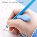 Pen Hold Corrector Pencil Grips Handwriting Posture Correction 2499. 