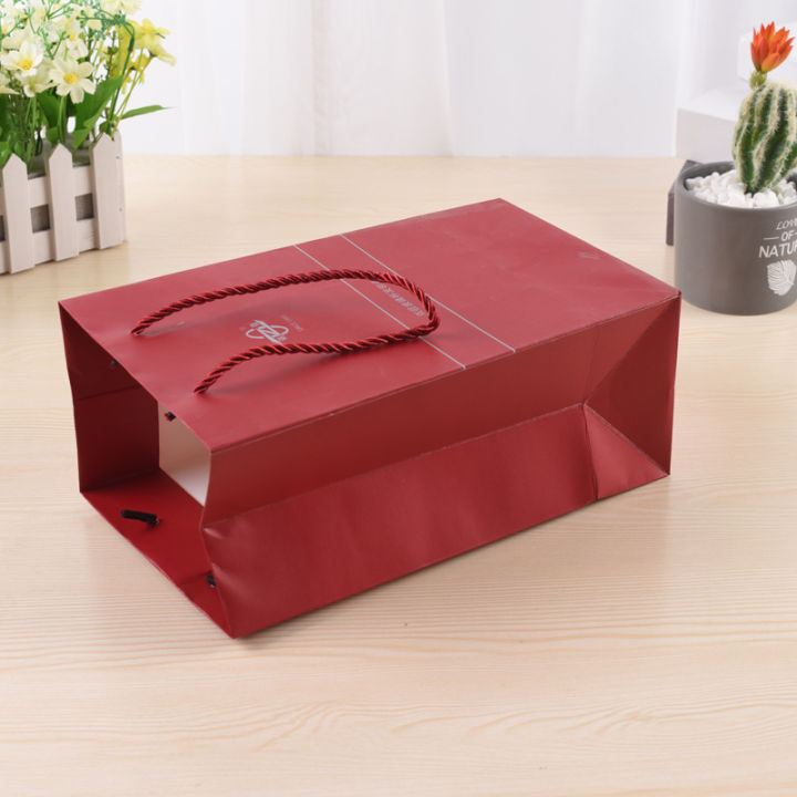 Portable%20paper%20bag%20custom%20white%20cardboard%20handbag%20gift%20paper%20bag%20custom%20advertising%20clothing%20shopping%20bag%20printing%20UV%20top%20system%20-%20Image%203