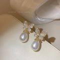 Korean version of fashion hot selling earrings simple temperament crystal butterfly pearl ear nail Earrings women. 