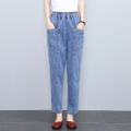 Fashionable mom jeans women's spring and summer harem radish pants high-waisted slim middle-aged casual women's cropped pants. 