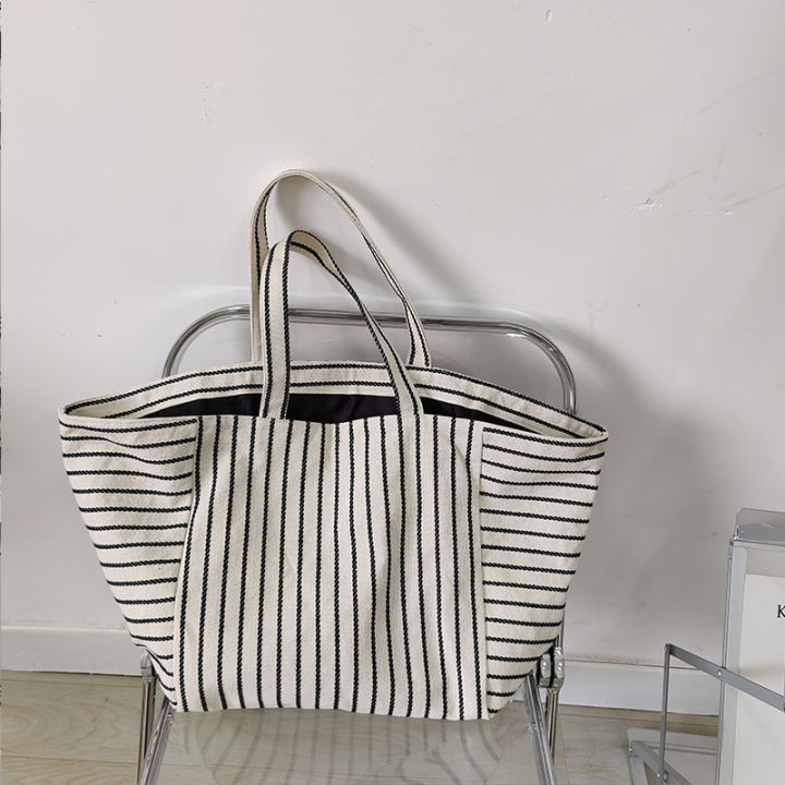 Canvas%20bag%20women's%20ins%20one-shoulder,%20large-capacity,%20lazy%20wind,%20striped%20fashion,%20big%20bag,%20casual%20literary%20hand-tote%20bag%20women%20-%20Image%204