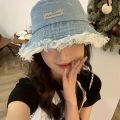 Fashionable Distressed Denim Fisherman Hat Women Washed Denim Bucket Cap with Tassel and Iron Label Outdoor Sun Protection Wide Brim.