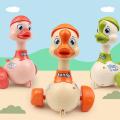 【The road to happiness Store】Child Cute Press Inertial Toys Funny Cartoon Duck Turn Around Baby Kids Infant Crawling Shaking Ring Bells. 